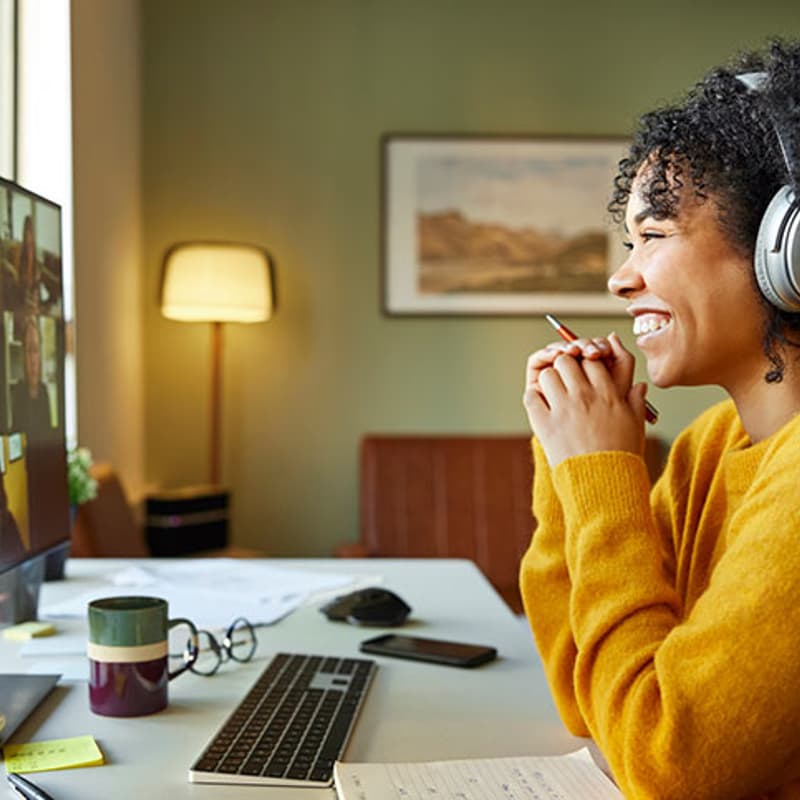 Participant smiling during a live online Intentional Leadership Lab session