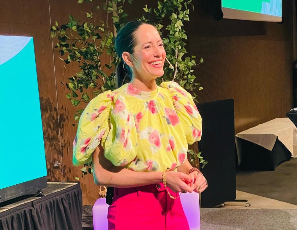 Sol Piñero Misa smiling on stage during a keynote
