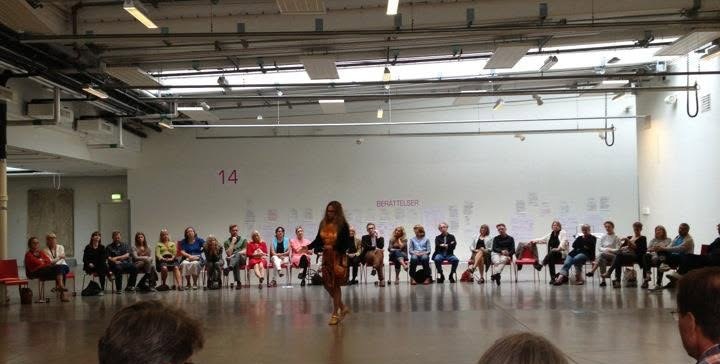 An Open Space session — a large circle of participants in a bright hall