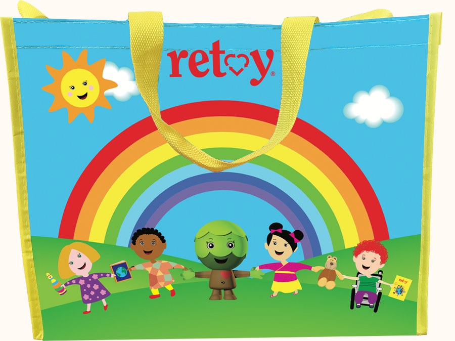 A Retoy welcoming bag with rainbow print and children holding hands